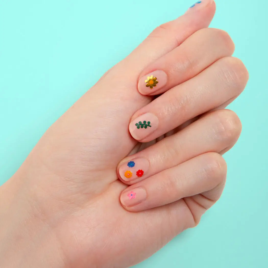 nail stickers shaped like flowers on a nail