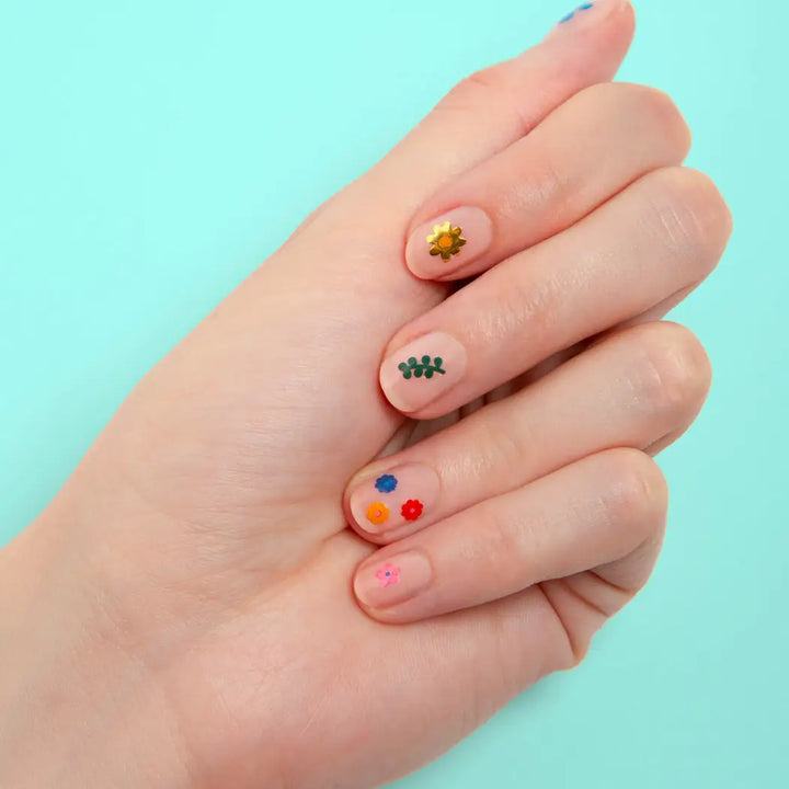 nail stickers shaped like flowers on a nail