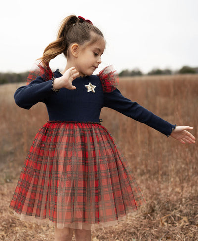 little girl modeling the dress with navy top and red tulle bottom. 