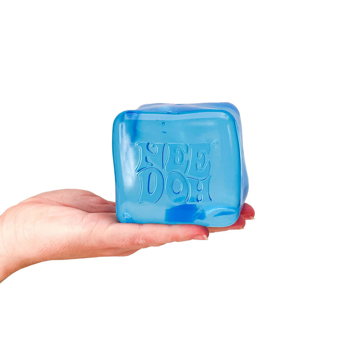 Blue squish toy with 'Needoh' text held in a hand on a white background