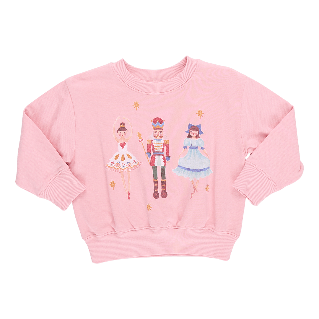 pink sweatshirt with the nutcracker, sugarplum fairy and clara on it.  The design is a watercolor design. 
