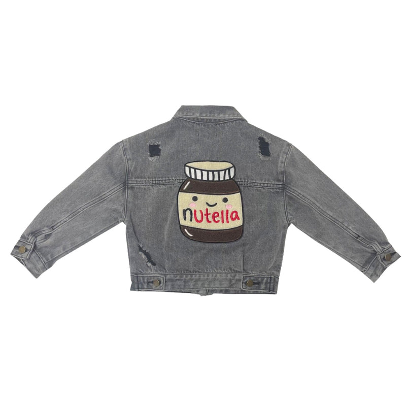 gray distressed denim jacket with a big Nutella patch on it. The nutella bottle has a happy face on it. 