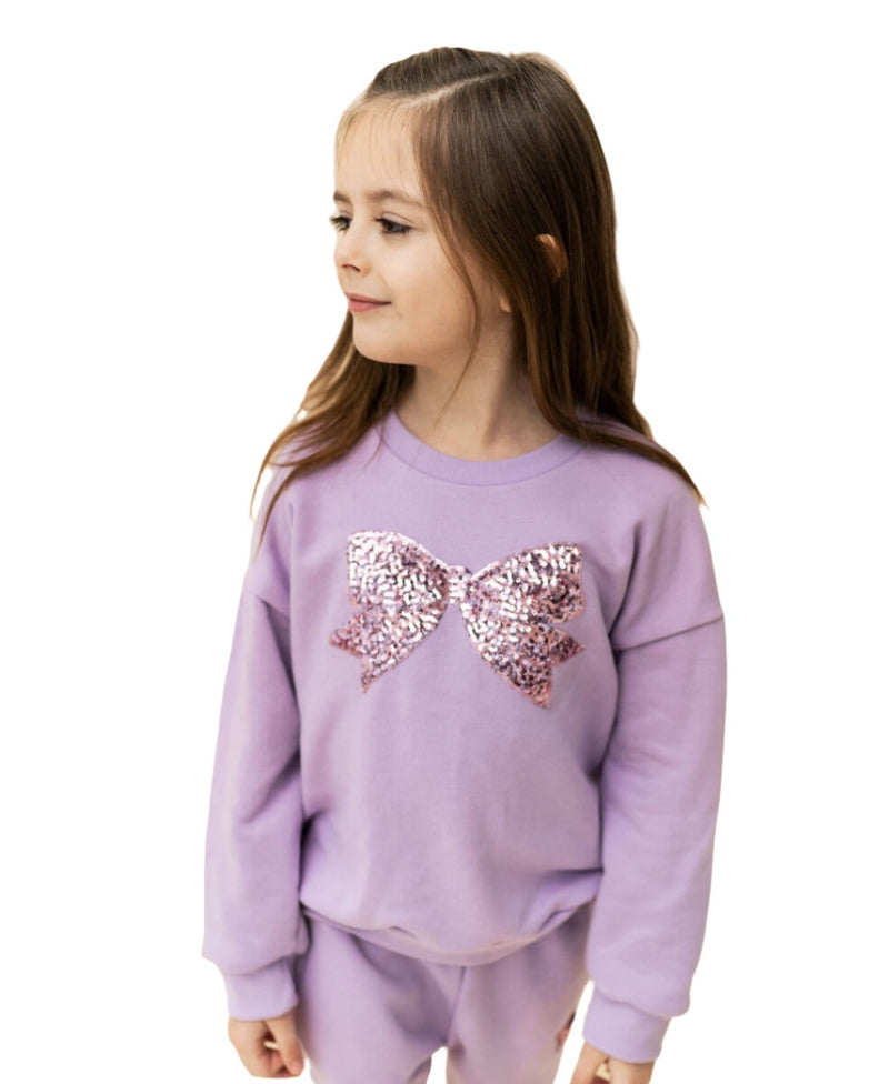 another angle of the lavender sweatshirt with pink bow applique