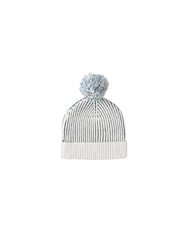 Knitted beanie with a pom-pom on a white background