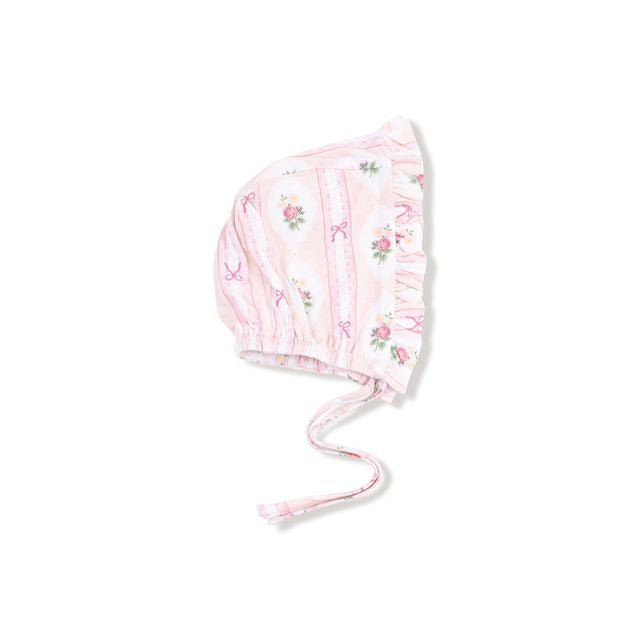 Pink baby bonnet with floral patterns on a white background