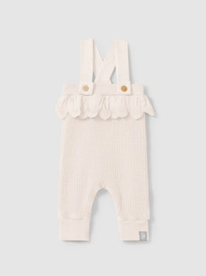 light pink waffle cotton overalls with eyelet ruffle around the waist