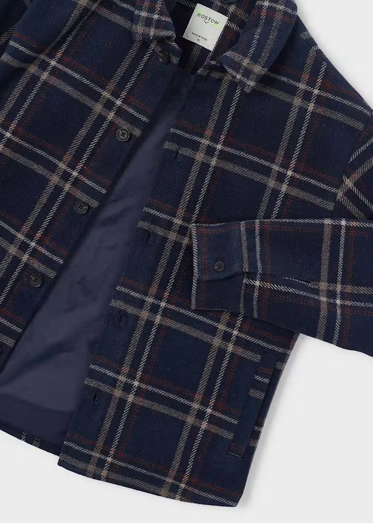 Navy plaid shirt with a visible brand label on a white background