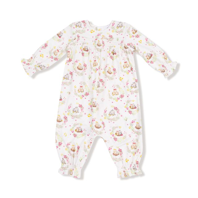 Baby onesie with floral and owl pattern on a white background