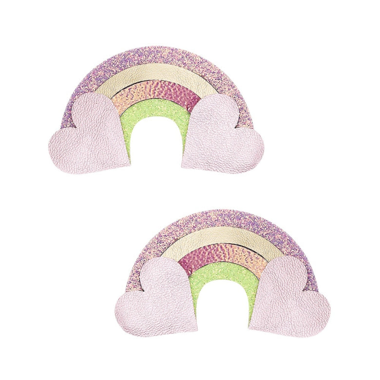 Two rainbow-shaped plush toys with pink hearts on a white background