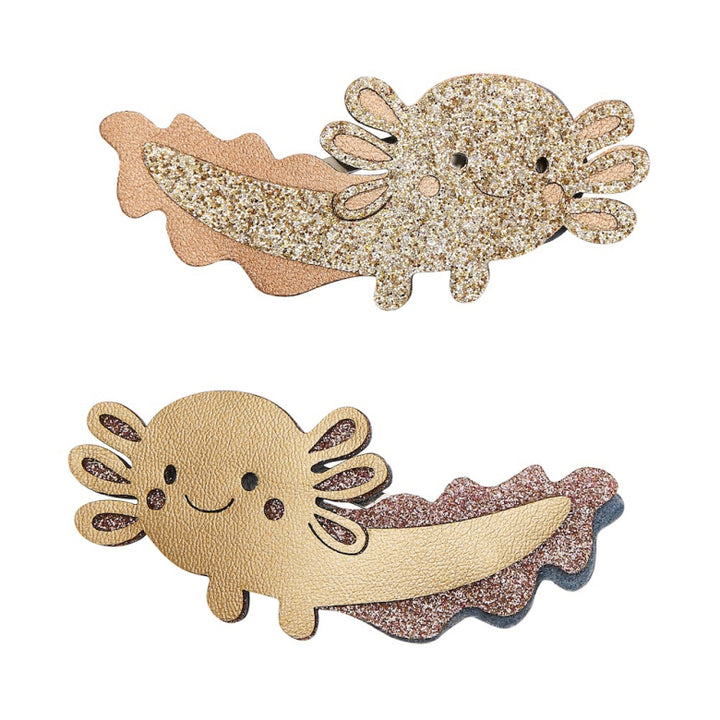 Two axolotl-shaped hair clips with glittery texture on a white background