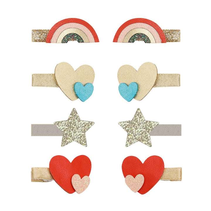 Set of colorful hair clips with heart, star, and rainbow designs on a white background