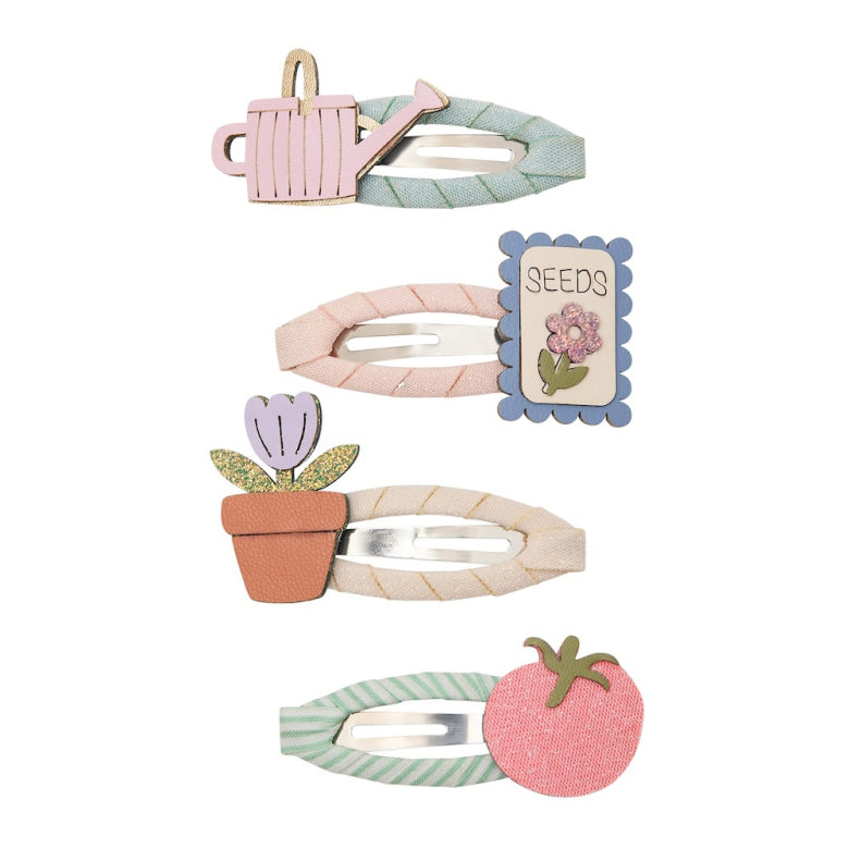 Set of floral-themed hair clips on a white background