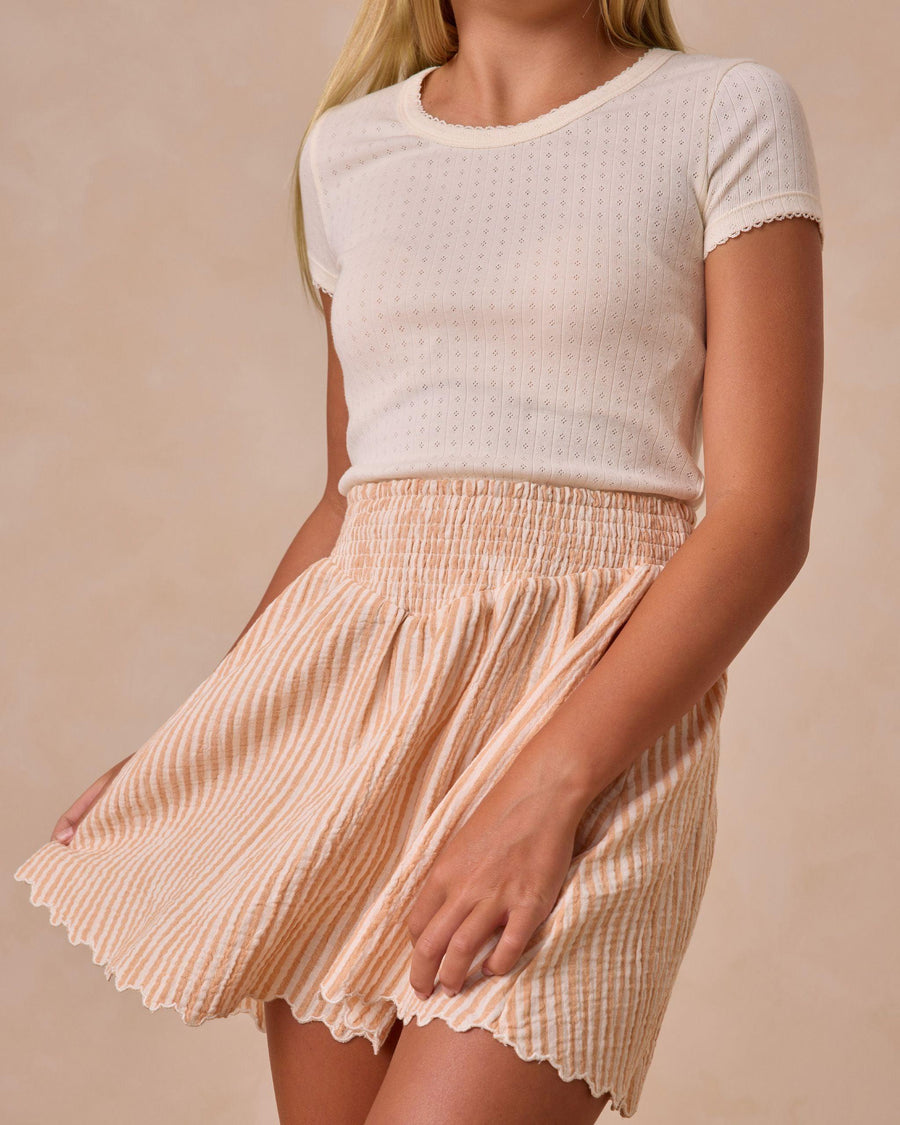 close up image of the grapefruit seersucker skirt. 