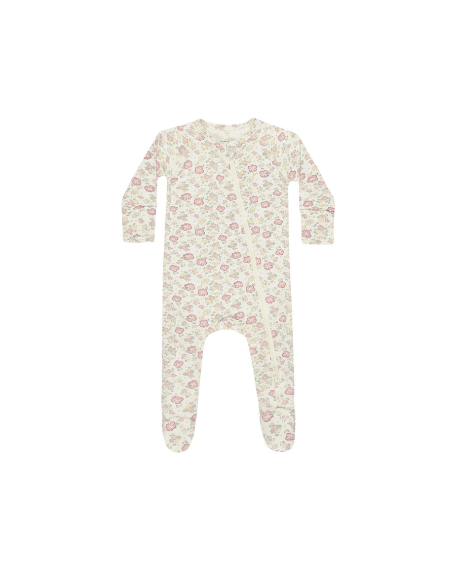 baby footie with zipper running diagonally across. the footie is beige with pink and sage flowers 