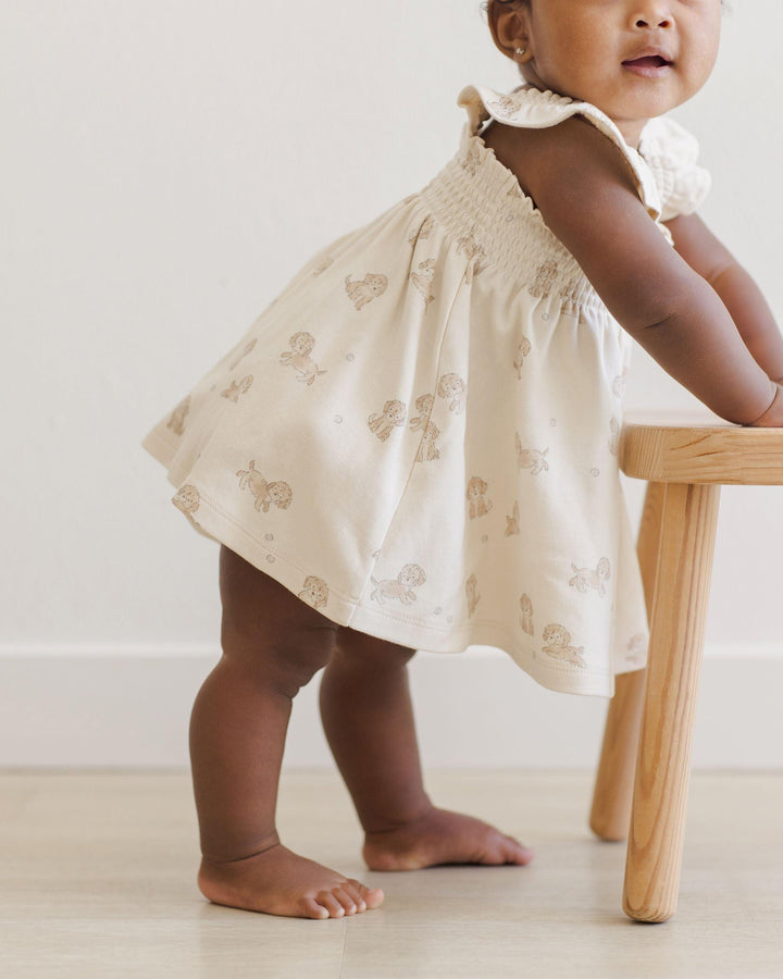 little girl modeling the dress and showing that the dress actually hits mid thigh. 