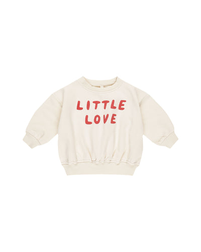 beige sweatshirt with the words "Little Love" written across the front in burgundy