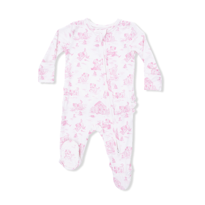 Baby onesie with pink puppy pattern on a white background