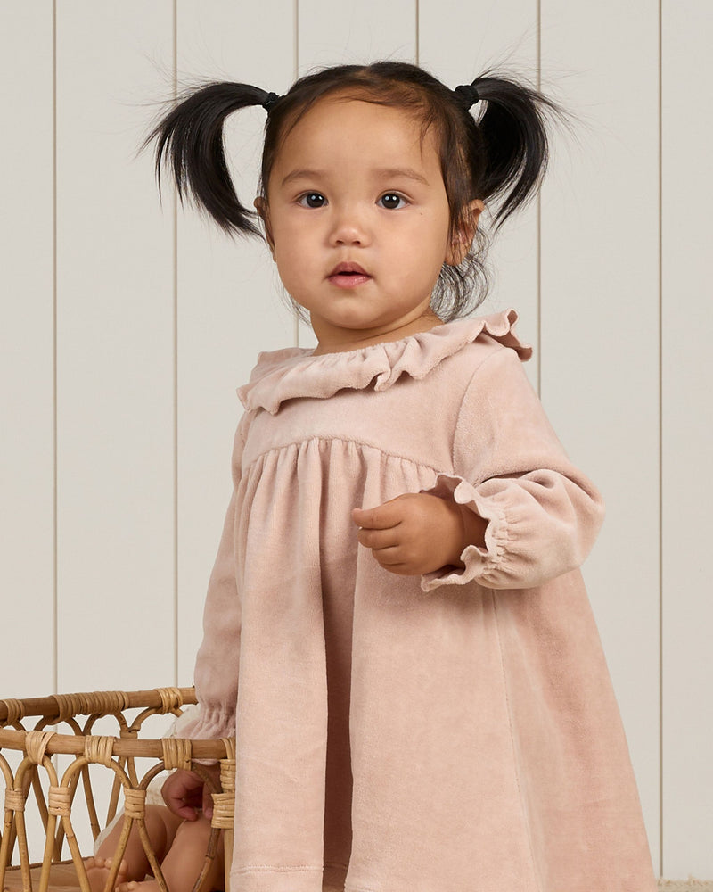 baby girl modeling the velour blush dress. 