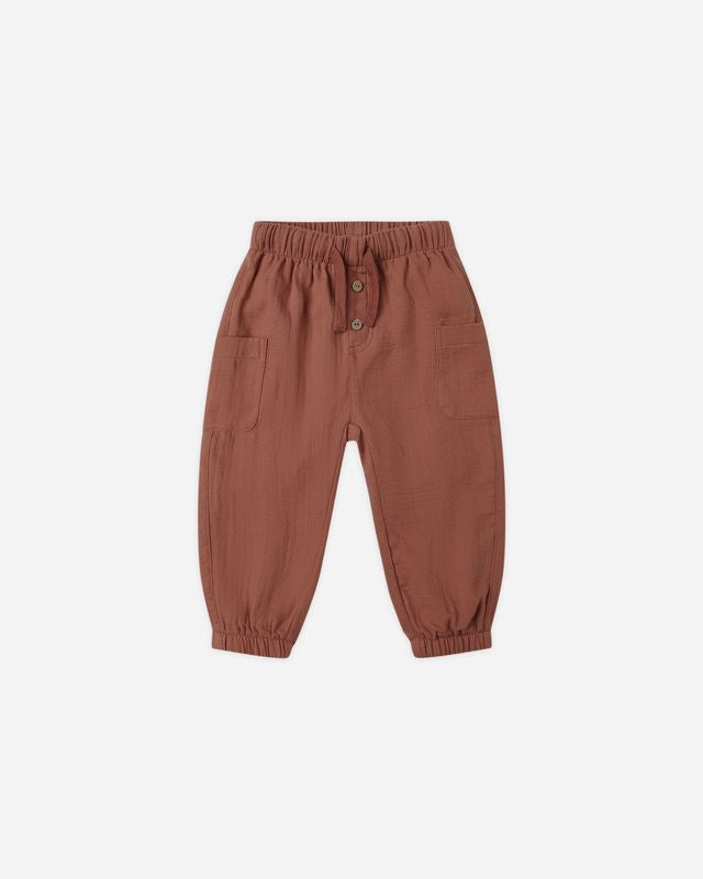 Burnt red children's pants on a white background