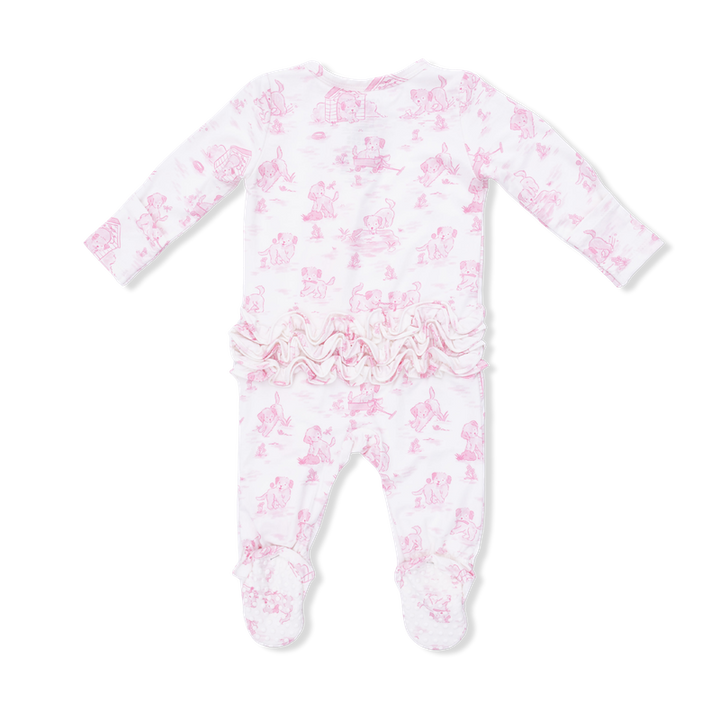 Baby onesie with pink puppy pattern and ruffles on the bottom on a white background