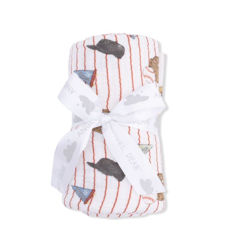 Baby blanket with whale pattern and white ribbon on a white background