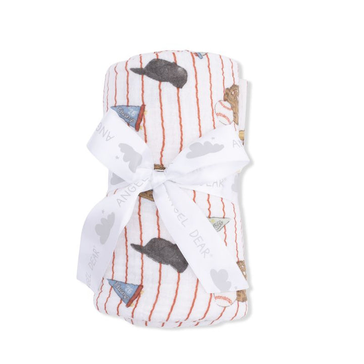 Baby blanket with whale pattern and white ribbon on a white background