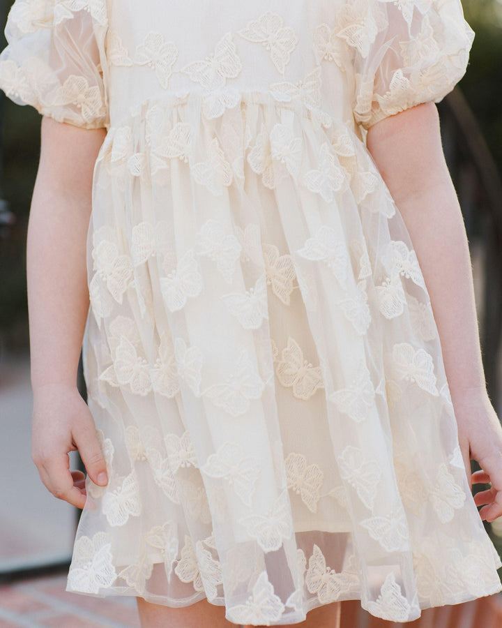up close look at the skirt and the butterflies all over the bodice and skirt. butterflies are slightly textured. 