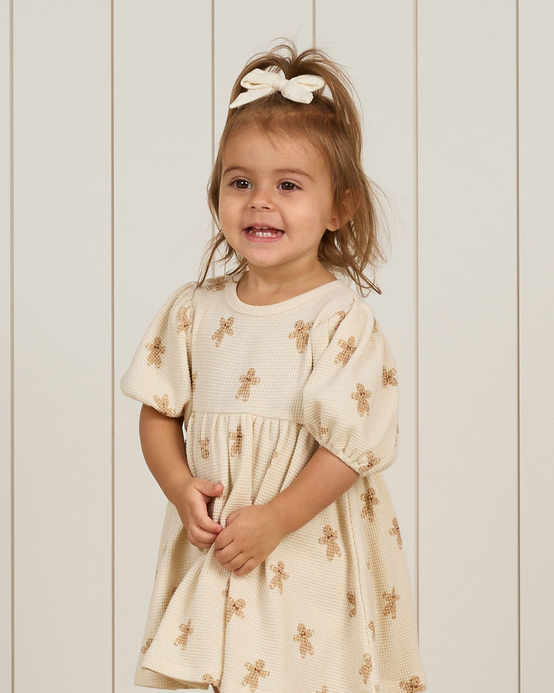 little girl modeling the gingerbread men dress 