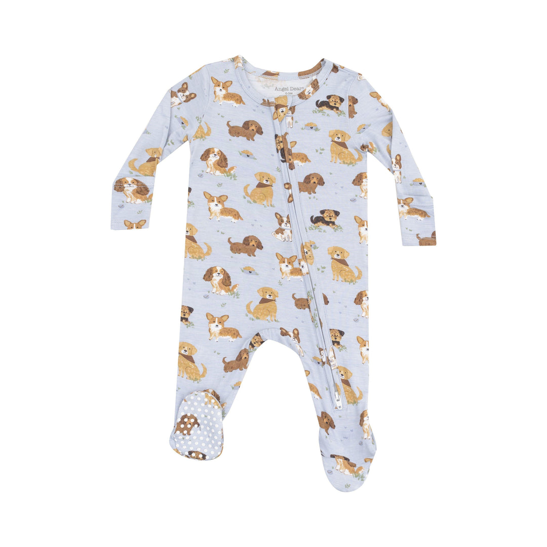 baby boy footie in blue colorway with puppies all over it. different brred dogs. 