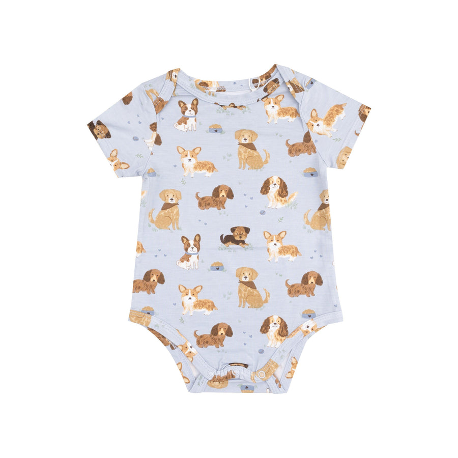 baby bodysuit with short sleeves and all different dogs all over it with a blue background color 