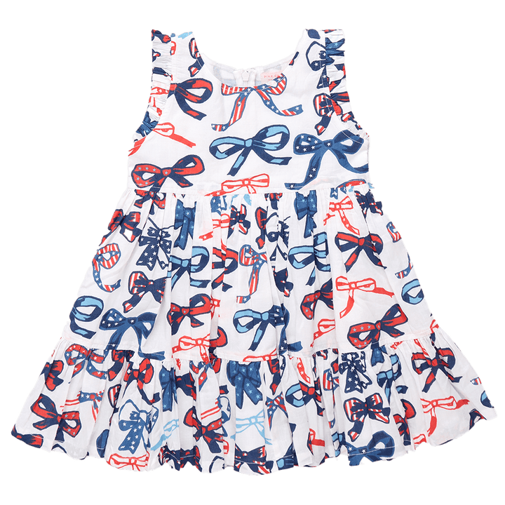 sleeveless dress, white background with red and white blue stripes and stars in the bows. 