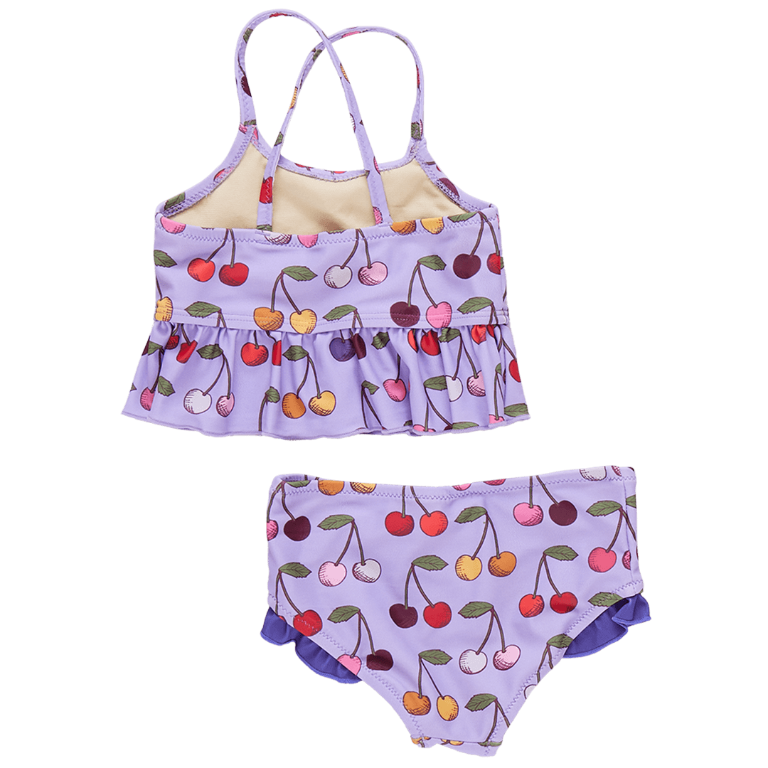 two piece girls bathing suit lavender color with muli colored cherries all over . this picture shows you the back of the suit with criss cross straps. 