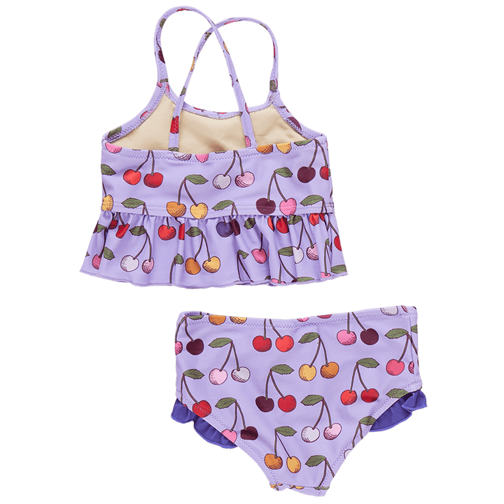 two piece girls bathing suit lavender color with muli colored cherries all over . this picture shows you the back of the suit with criss cross straps. 