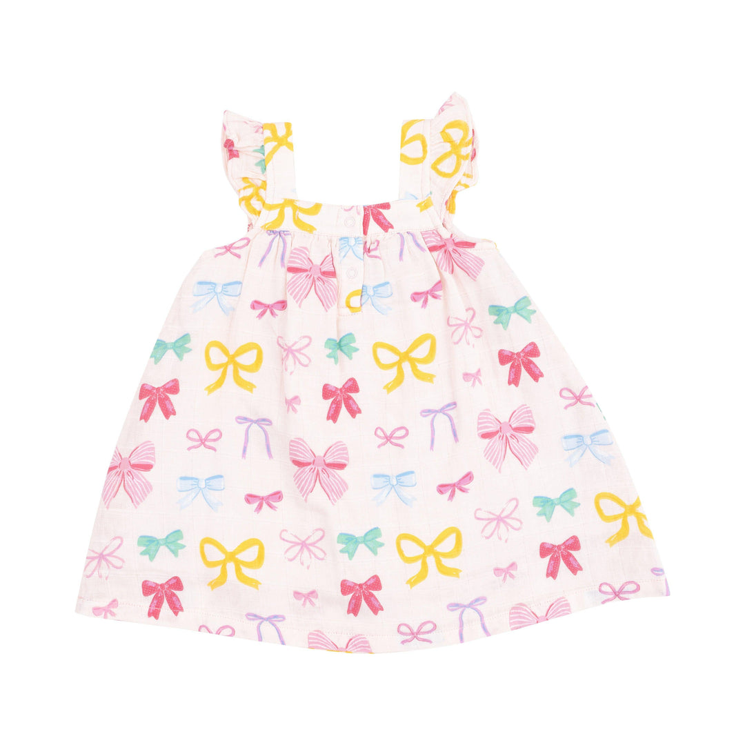 girls dress a-line silhouette with ruffle at the sleeve and knee length. multi colored bows: pink, yellow, green and purple. 