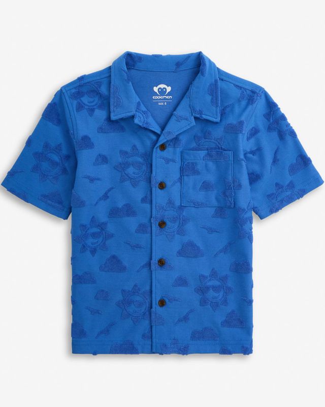 cobalt Blue terry cloth cloud and sun patterns on the shirt with button details on a white background