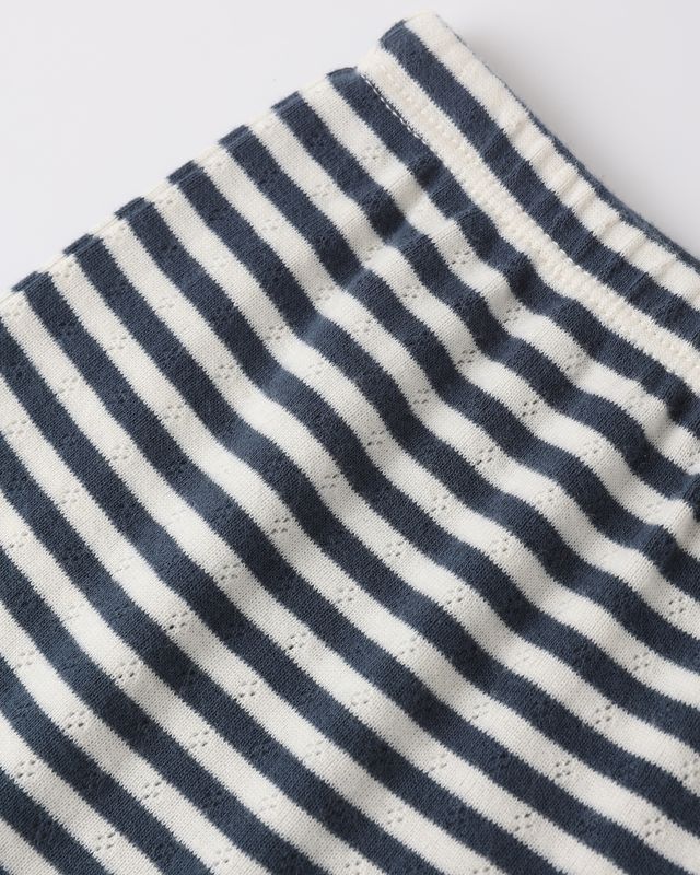 Close-up of navy and white striped fabric on a light gray background