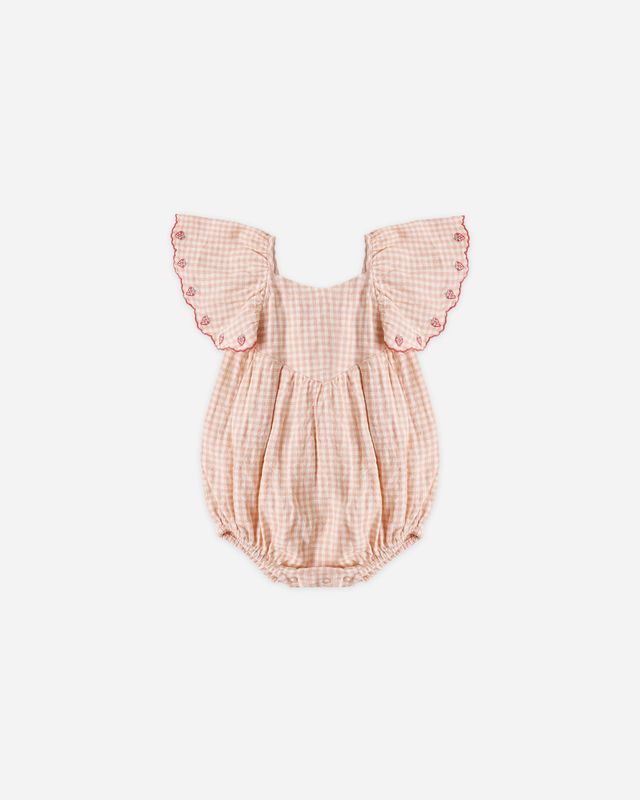 Pink checkered baby romper with ruffled sleeves on a light gray background