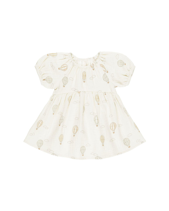beige blouson dress with pastel hot air balloons printed all over