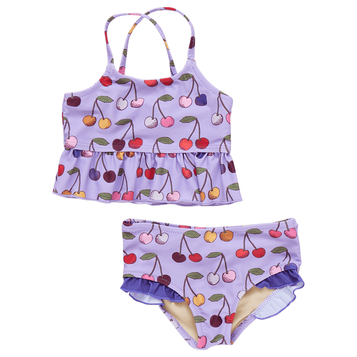 2 piece bathing suit with multi colored cherries all over it. the top has criss cross straps and a big ruffle at the bottom. the bottom has tiny ruffles along the opening of the leg. 