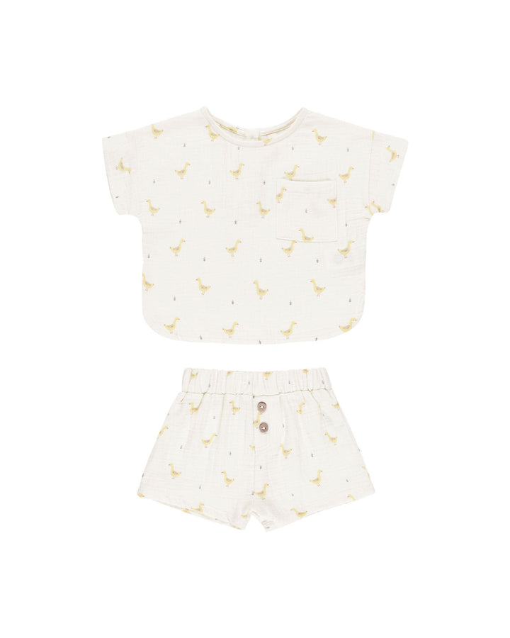 woven 2 piece ivory set with yellow geese all over both the top and bottom. top is short sleeve and bottoms are shorts. 