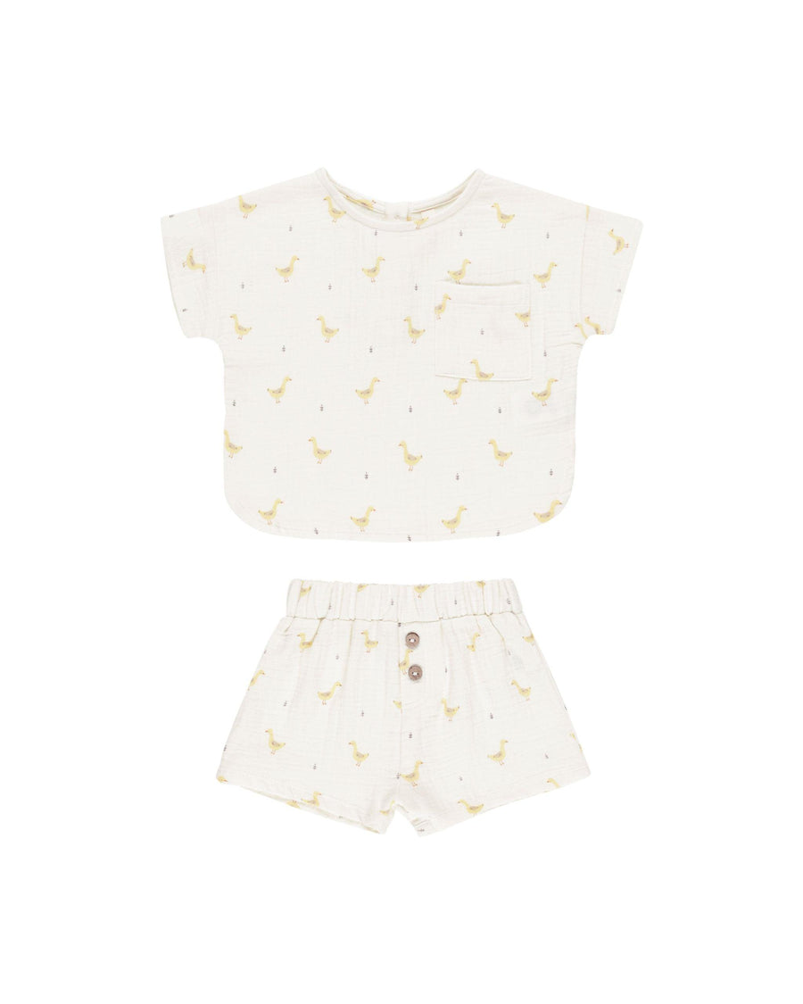 woven 2 piece ivory set with yellow geese all over both the top and bottom. top is short sleeve and bottoms are shorts. 