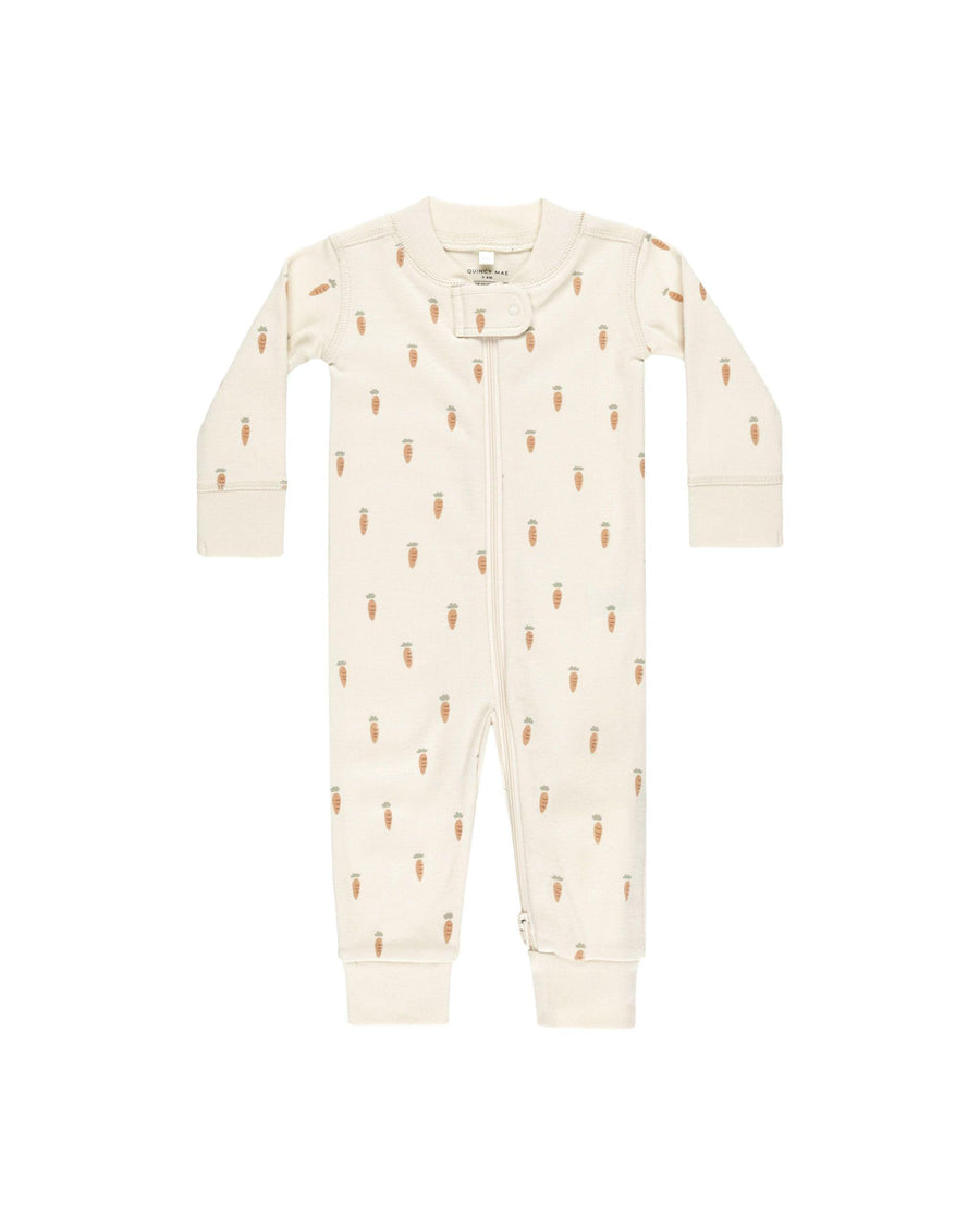 beige zipper onesie outfit with tiny orange carrots all over the onesie