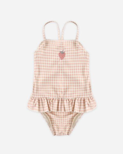 Pink gingham baby romper with ruffle details on a white background