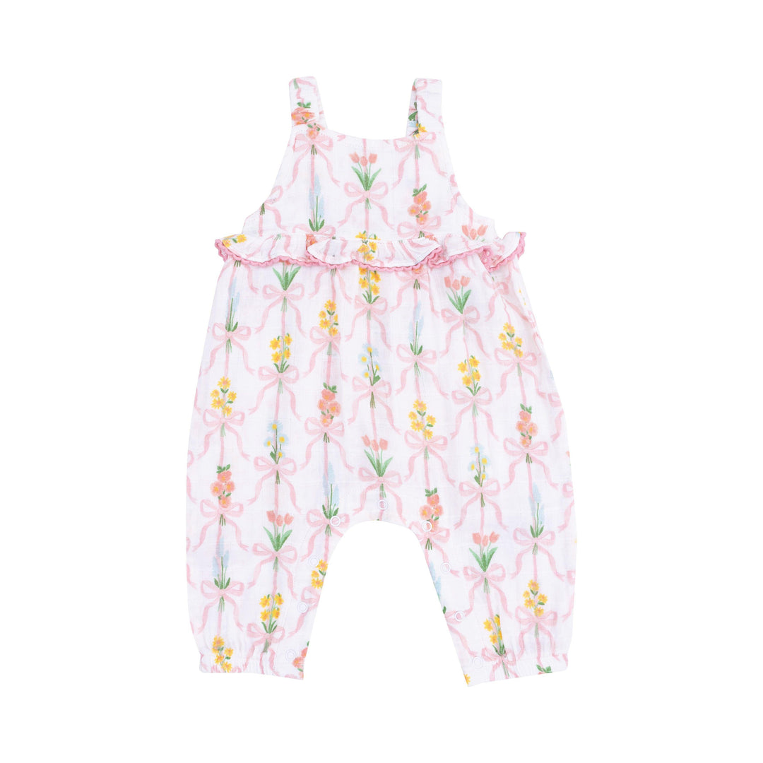 ruffle waist romper white background with floral bouquets tied with ribbons around the bouquet. 