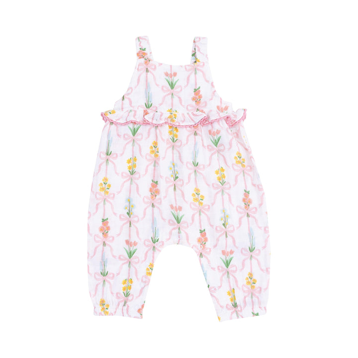 ruffle waist romper white background with floral bouquets tied with ribbons around the bouquet. 