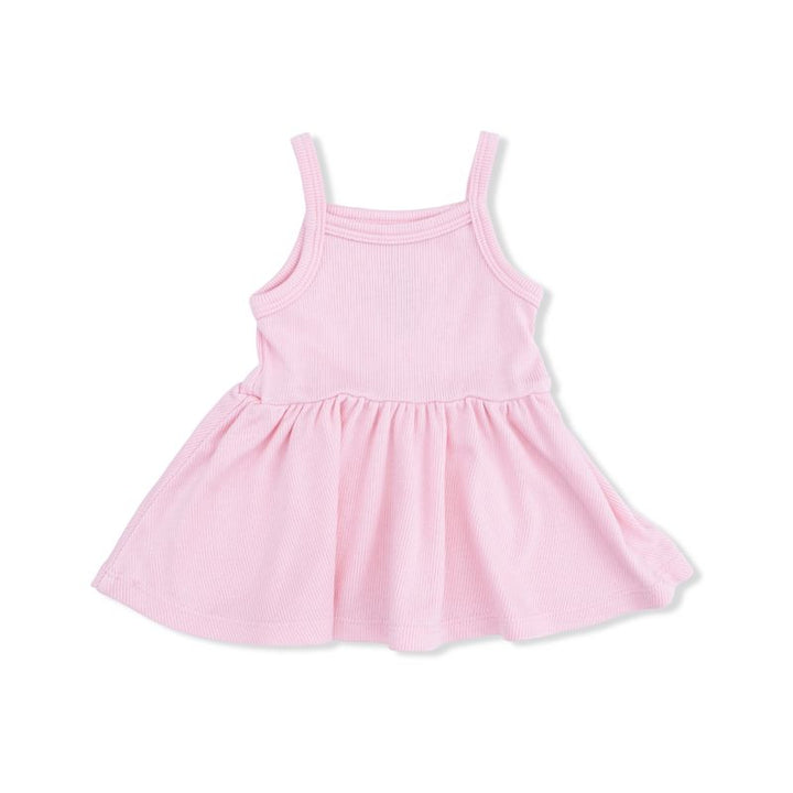 Pink peplum top on a white background