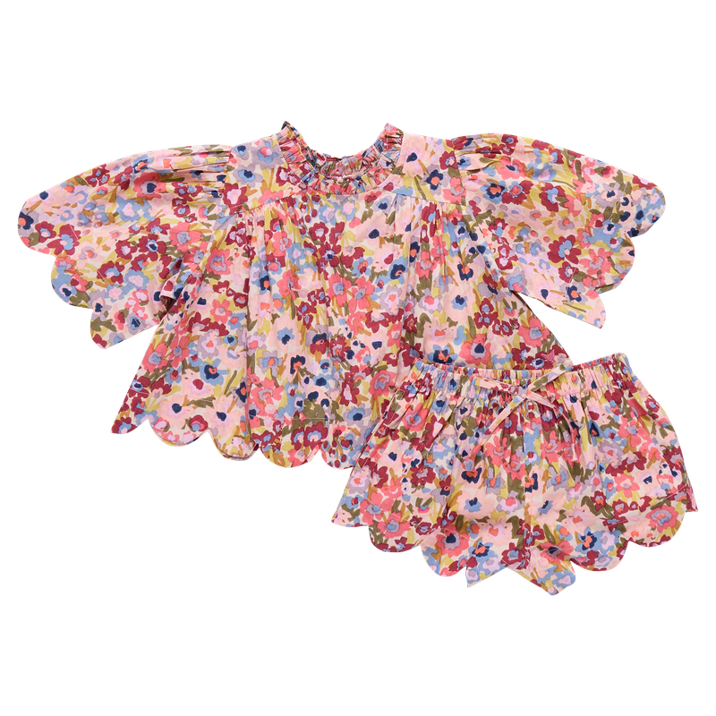 Floral 2 piece set with ruffled sleeves and bottom on a white background