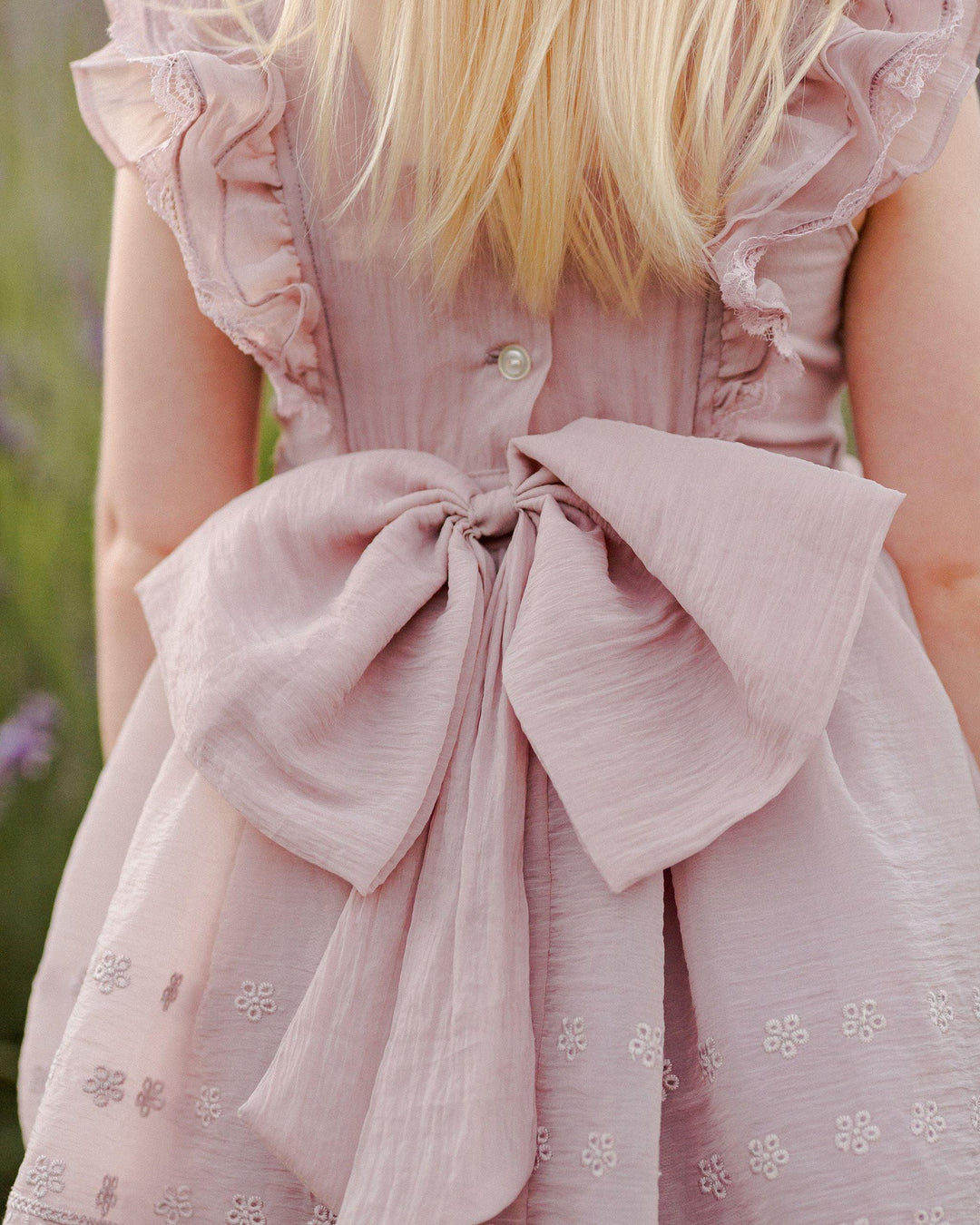 the back of this dress has a big beautiful organza bow and buttons up the back. 