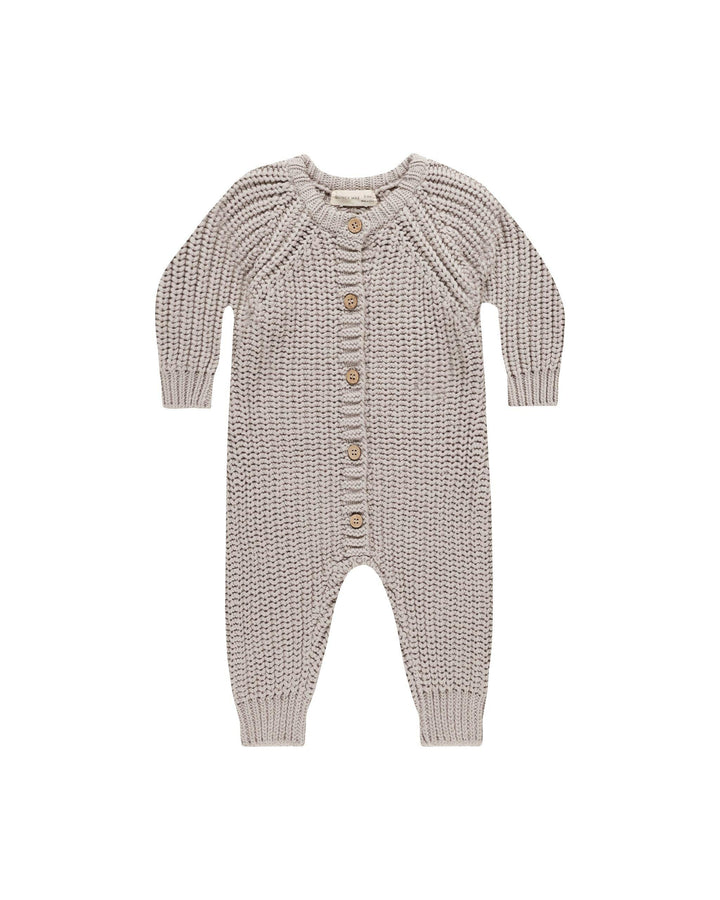 chunky light gray jumpsuit with buttons down the center. crewneck 