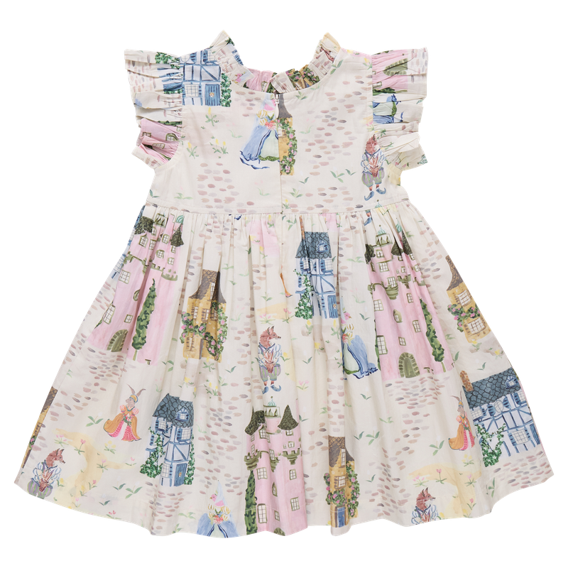 back of Children's dress with a colorful pattern of houses, castle and people on a white background